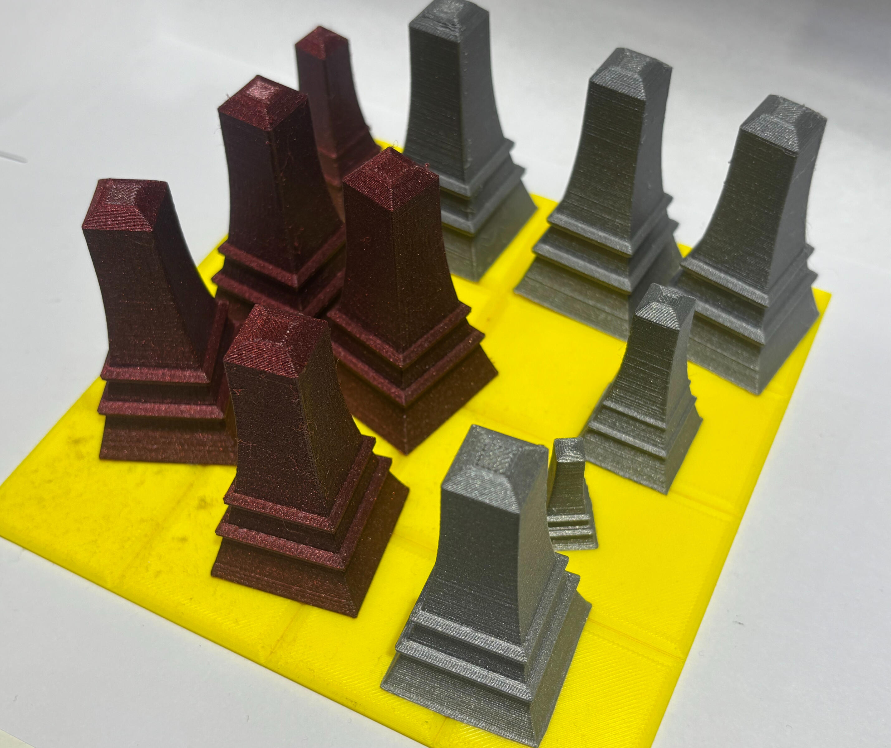 The new Tic-Tac-Toe game (self-designed): Unlike the traditional rules, in the new version, players capture smaller pieces by using the large ones.